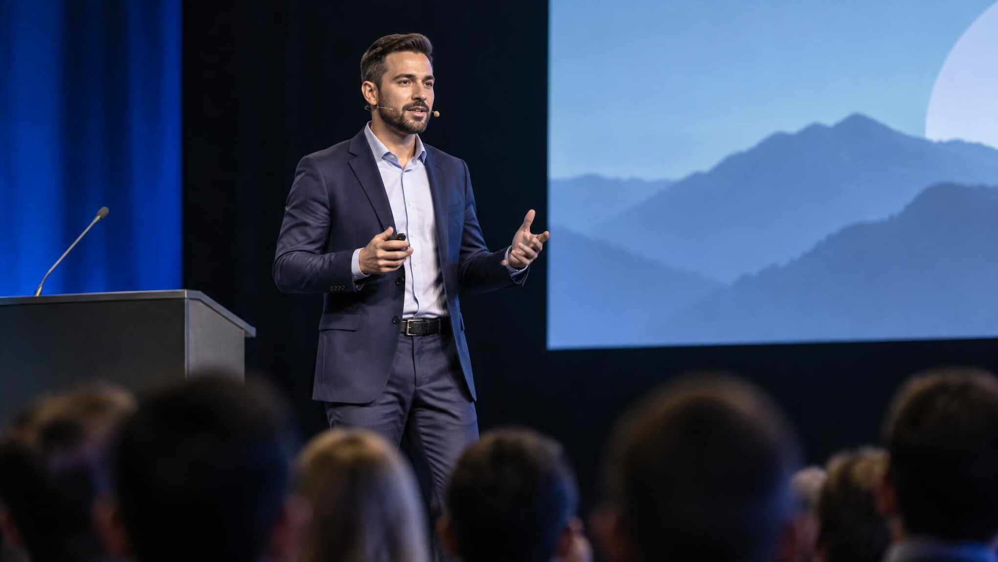 man giving speech on stage